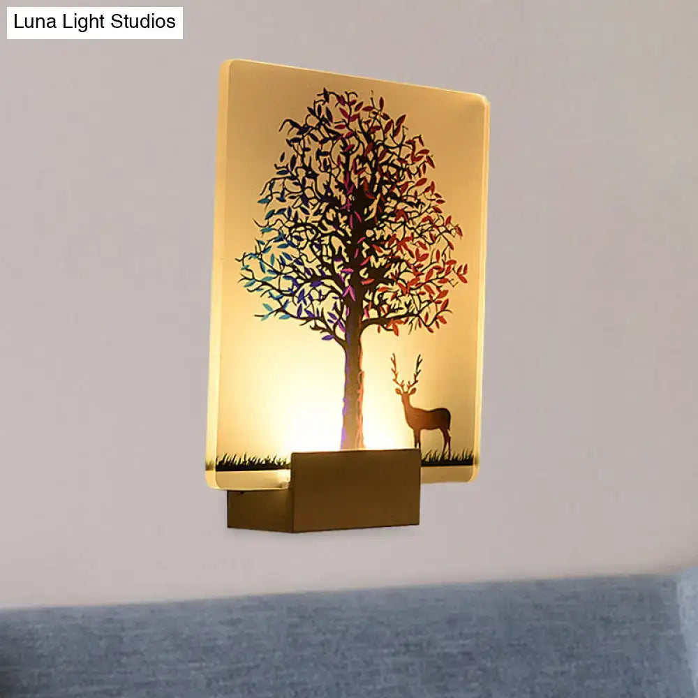 White elk tree led wall sconce with colorful tree and deer silhouette illuminated by warm golden glow for living room