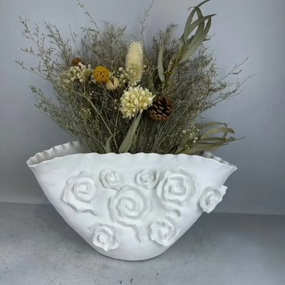 White embossed rose ceramic vase with scalloped rim holding dried botanicals decorbites embossed rose decor