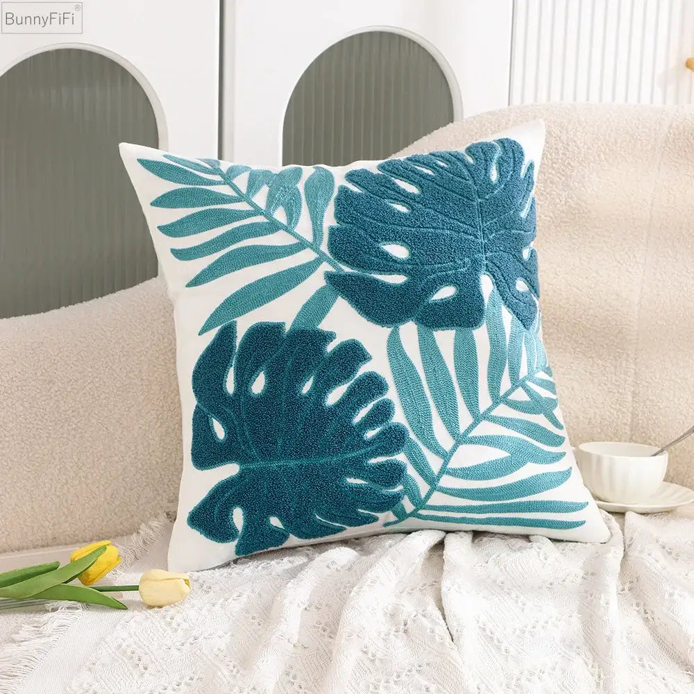 White cushion pillow case with teal embroidered tropical leaf pattern for decorbites cactus lemon living room decor
