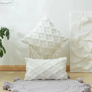 White embroidered diamond cushion cover with textured woven pattern in soft plush material for living room decor