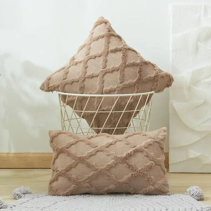 Beige textured throw pillows with embroidered diamond cushion cover and frayed edges for living room decor
