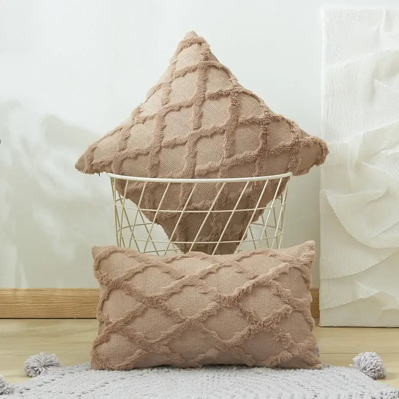 Beige textured throw pillows with embroidered diamond cushion cover and frayed edges for living room decor