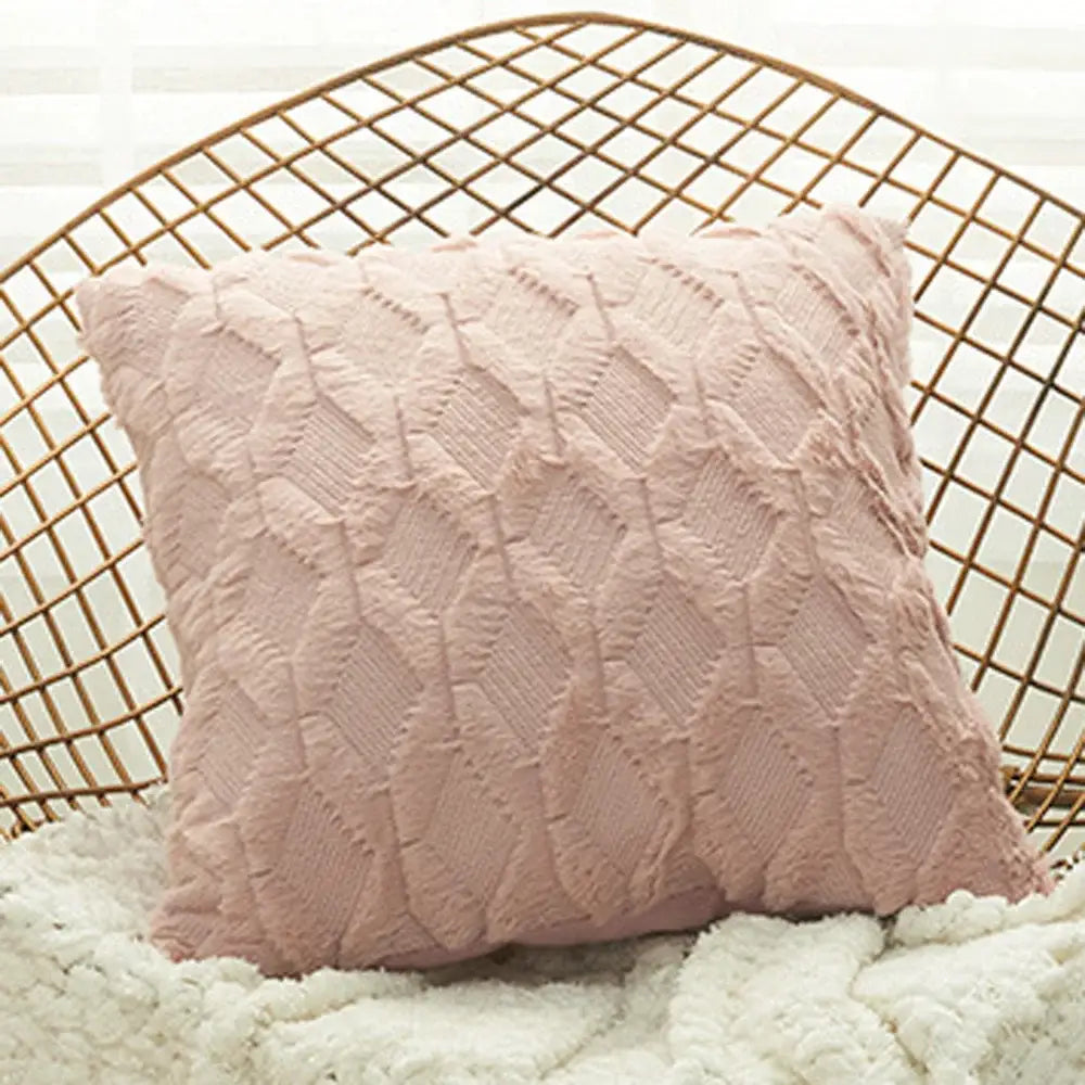 A soft blush pink embroidered diamond cushion cover with textured knit fabric for living room decor
