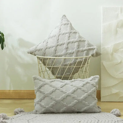 White embroidered diamond cushion cover in light gray with textured pattern and pom-pom accents for living room decor