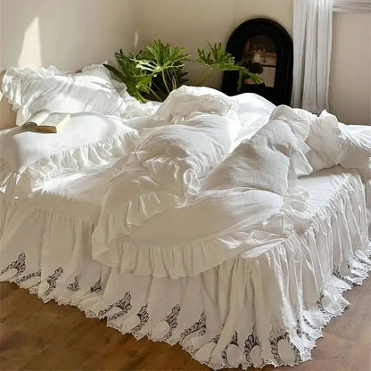 White embroidered lace cotton ruffles bedding set featuring white ruffled bed set with lace trim and embroidered details
