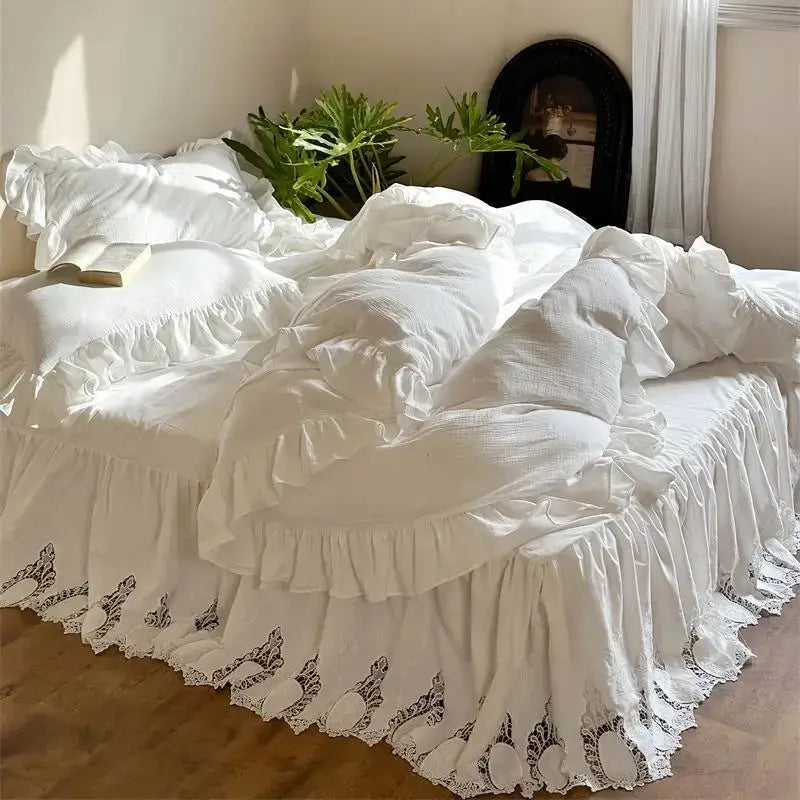 White embroidered lace cotton ruffles bedding set featuring white ruffled bed set with lace trim and embroidered details