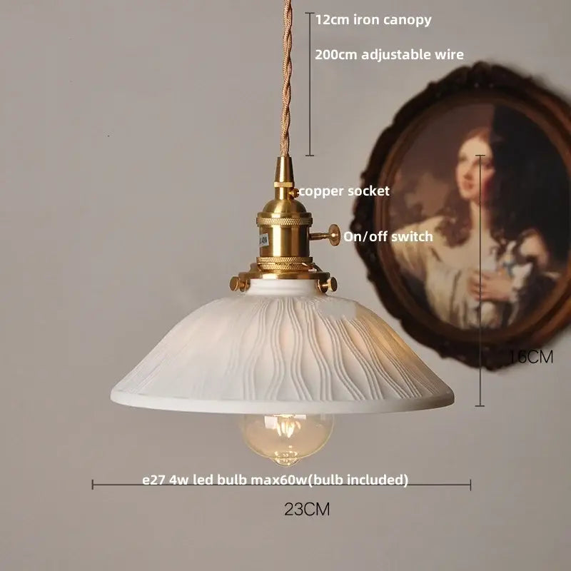 White enamel pendant light with textured ceramic knob switch and brass-finished metal components for kitchen decorbites pendant light