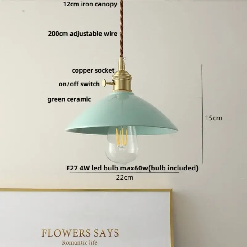 A mint green ceramic pendant light with brass copper socket and decorbites ceramic knob switch for kitchen lighting