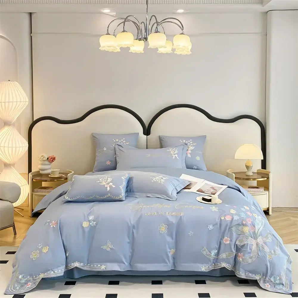 Light blue bedding set with decorbites butterfly flowers embroidery and delicate gold thread featuring love in spring inscription