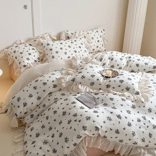 White floral cotton bedding set featuring delicate lace ruffles and ruffled edges for elegant bedroom decor