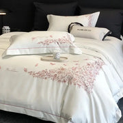 White mark cross bed set with delicate pink floral embroidery and red piping in egyptian cotton bedding sets