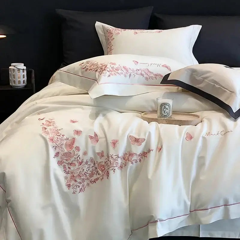 White satin duvet cover with pink butterfly floral embroidery and red piping in egyptian cotton bedding sets