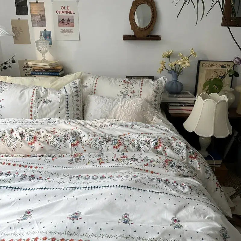 White floral embroidered cotton duvet cover set with delicate embroidery and subtle color accents for bedroom bedding