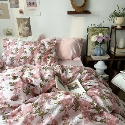 White floral embroidered cotton duvet cover set with pink blossoms and green leaves on soft satin-like fabric