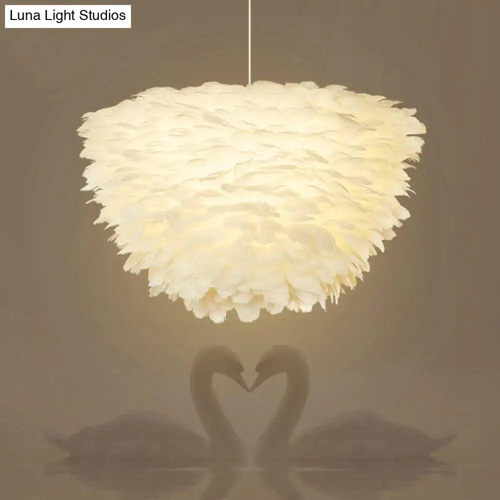 White floral pendant chandelier with soft off-white feather accents and a fluffy layered design for dining room