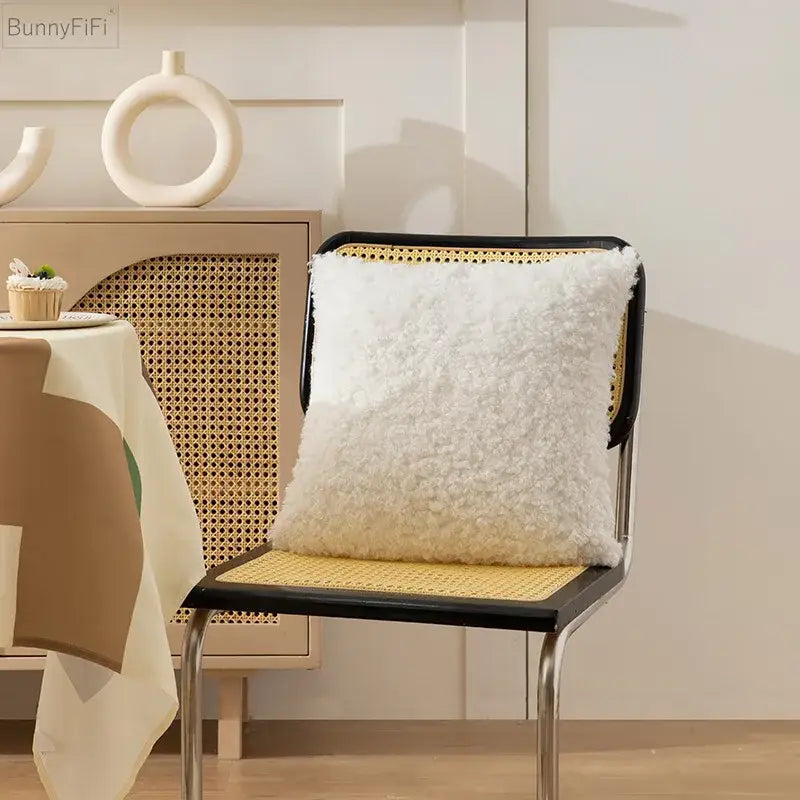 White fluffy ivorycamel polka dot cushion cover 45x45cm on cane chair with sheepskin style texture