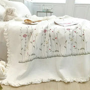 White fresh flower embroidered quilt set with delicate pink red and gray floral embroidery on ruffled cotton edge