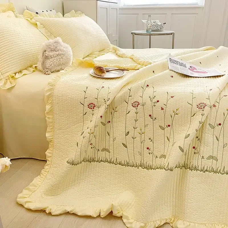 Soft pale yellow quilt set with fresh flower embroidered cotton fabric and ruffled edges from decorbites fresh flower collection