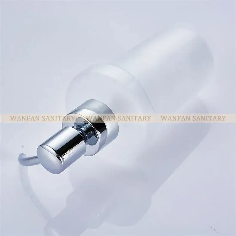 White frosted glass liquid soap dispenser with a gold pump and chrome finish for modern bathroom use