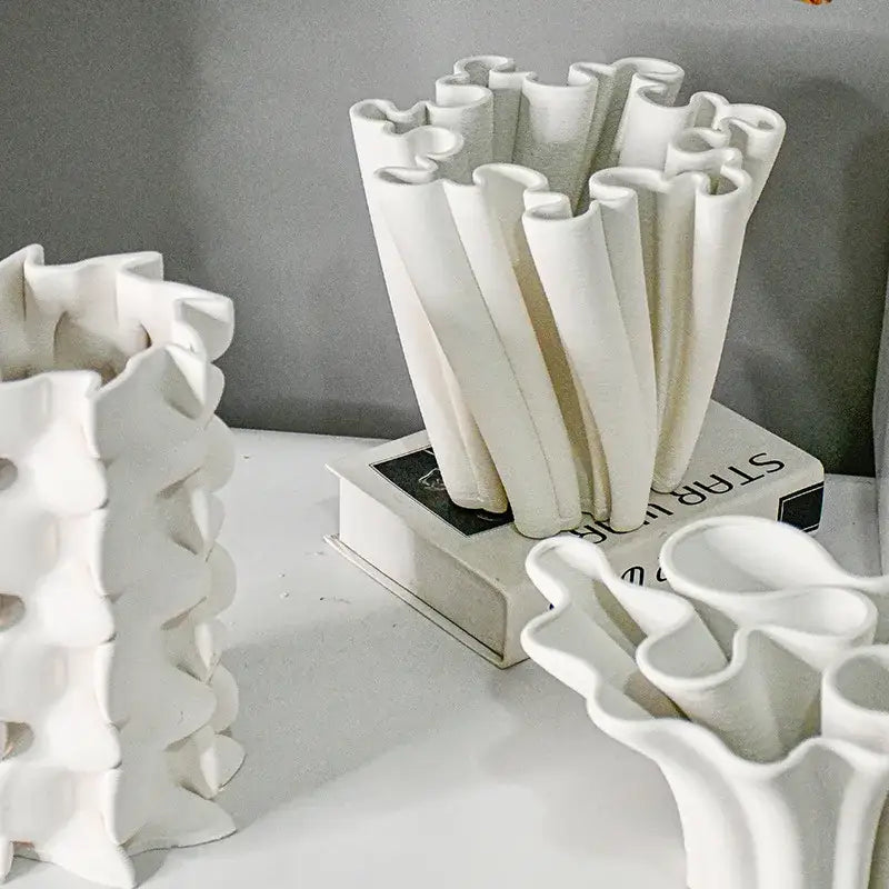 White geometric ceramic fold pattern vase with sculpted ruffled design for living room decorbites geometric ceramic decor