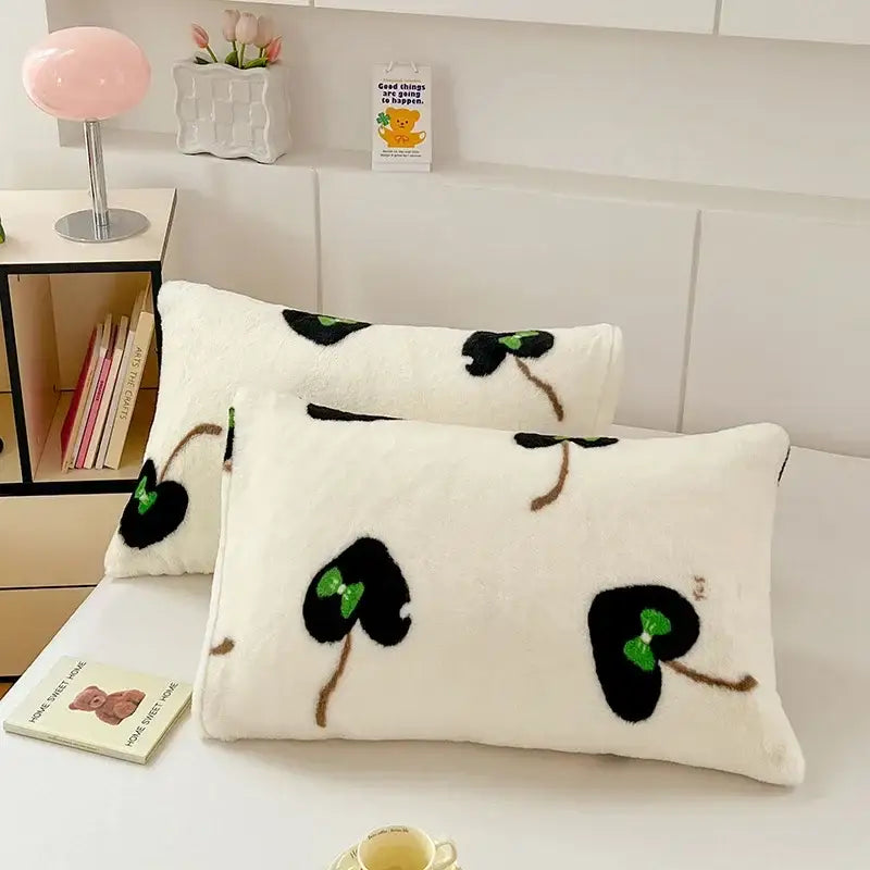 Cream-colored plush pillowcase with black and green leafy ginkgo design brown stems cozy winter plush decorbites