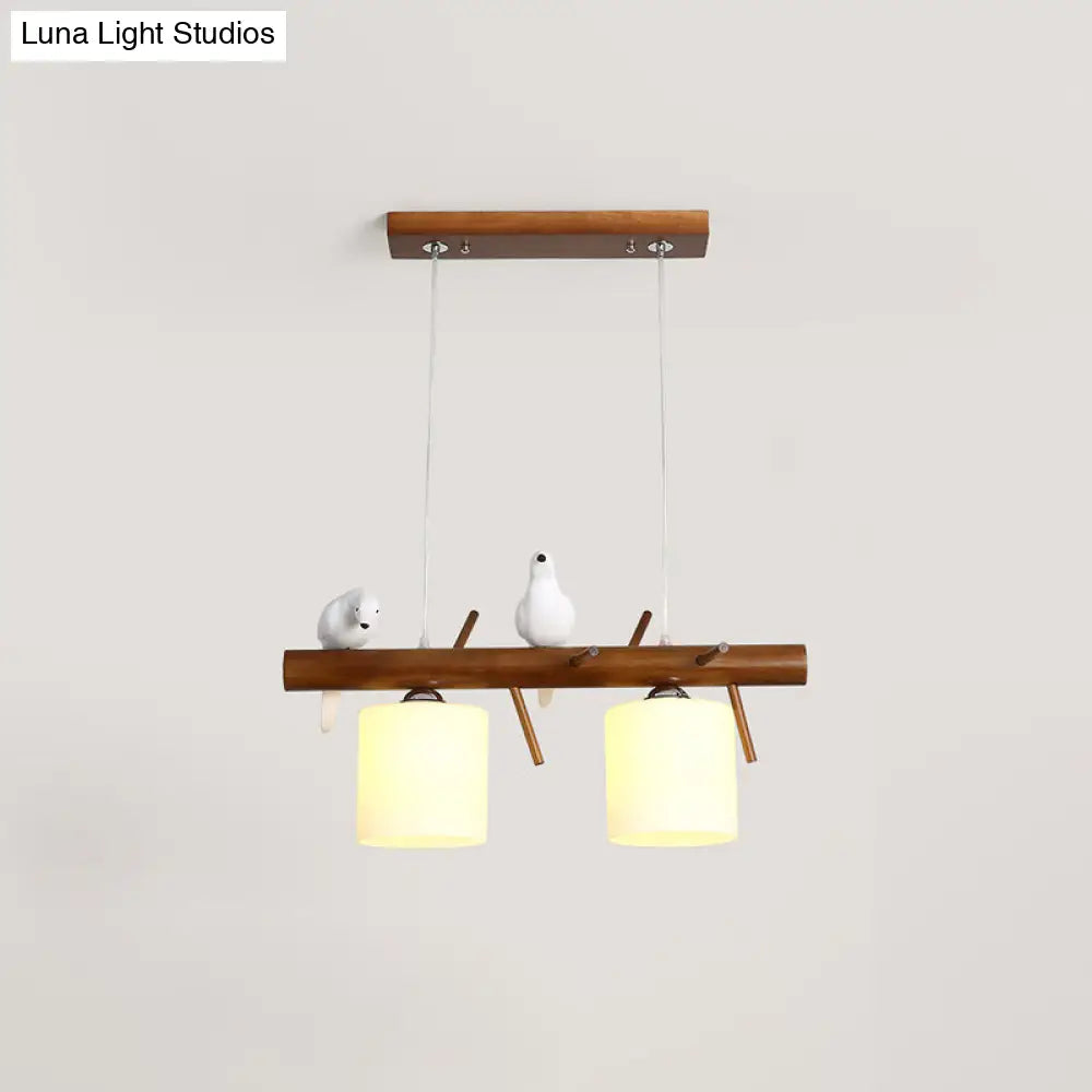 ديكوربايتس™ مصباح LED زجاجي أبيض مع طائر من الراتينج - تركيبات أسطوانية معلقة على جزيرة المطعم