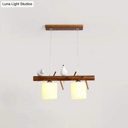 ديكوربايتس™ مصباح LED زجاجي أبيض مع طائر من الراتينج - تركيبات أسطوانية معلقة على جزيرة المطعم