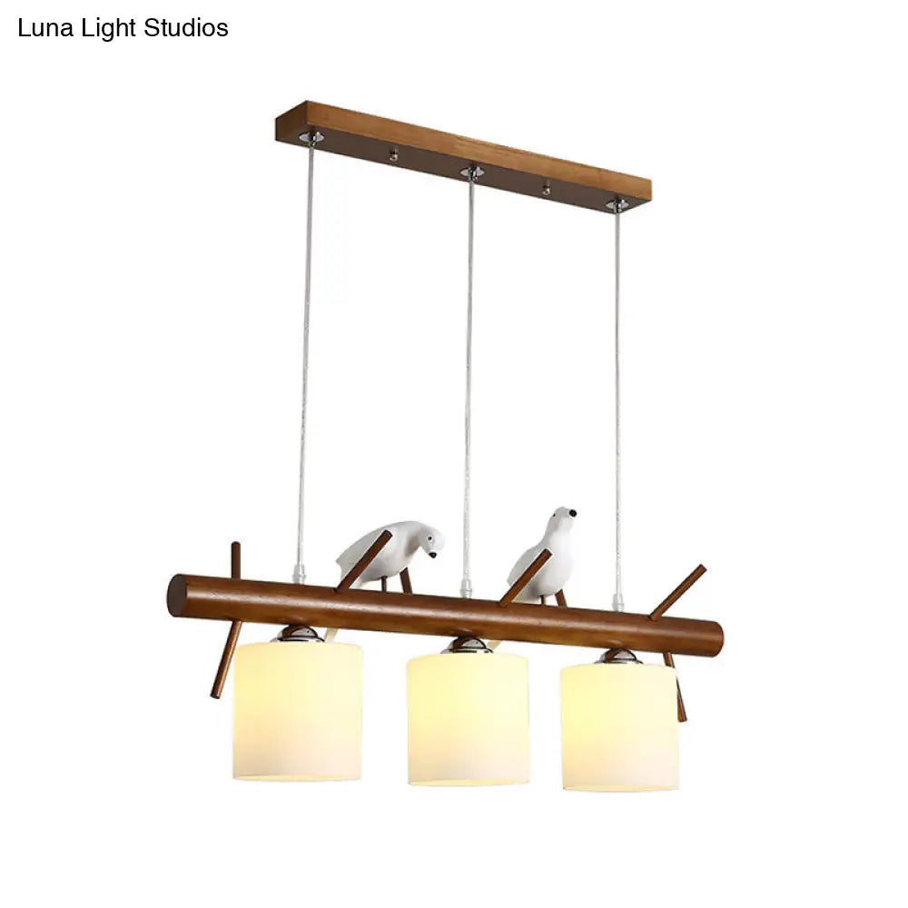 ديكوربايتس™ مصباح LED زجاجي أبيض مع طائر من الراتينج - تركيبات أسطوانية معلقة على جزيرة المطعم