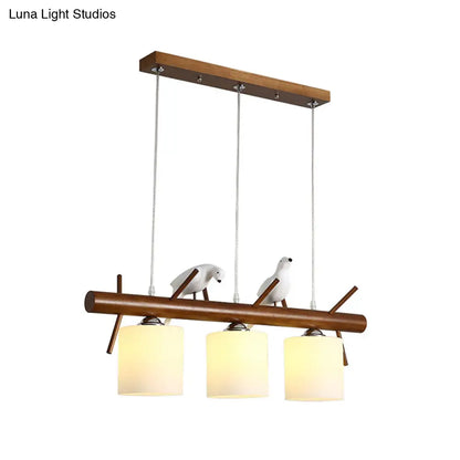 ديكوربايتس™ مصباح LED زجاجي أبيض مع طائر من الراتينج - تركيبات أسطوانية معلقة على جزيرة المطعم