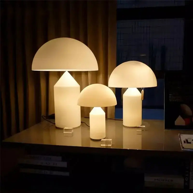 Three illuminated white glossy mushroom iron table lamps with opaque glass domes for bedroom decorbites iron table use