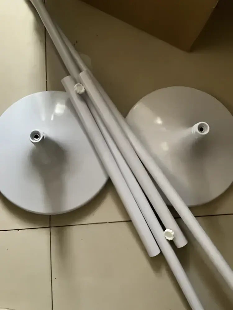 White glossy tulip butterfly chandelier stand with white plastic circular base legs and cylindrical poles for dining room use