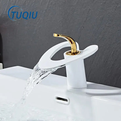 White and gold basin faucet with sleek curved spout modern waterfall design by decorbites golden white