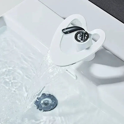 White ceramic basin faucet with sleek modern design and black handle from decorbites golden white collection