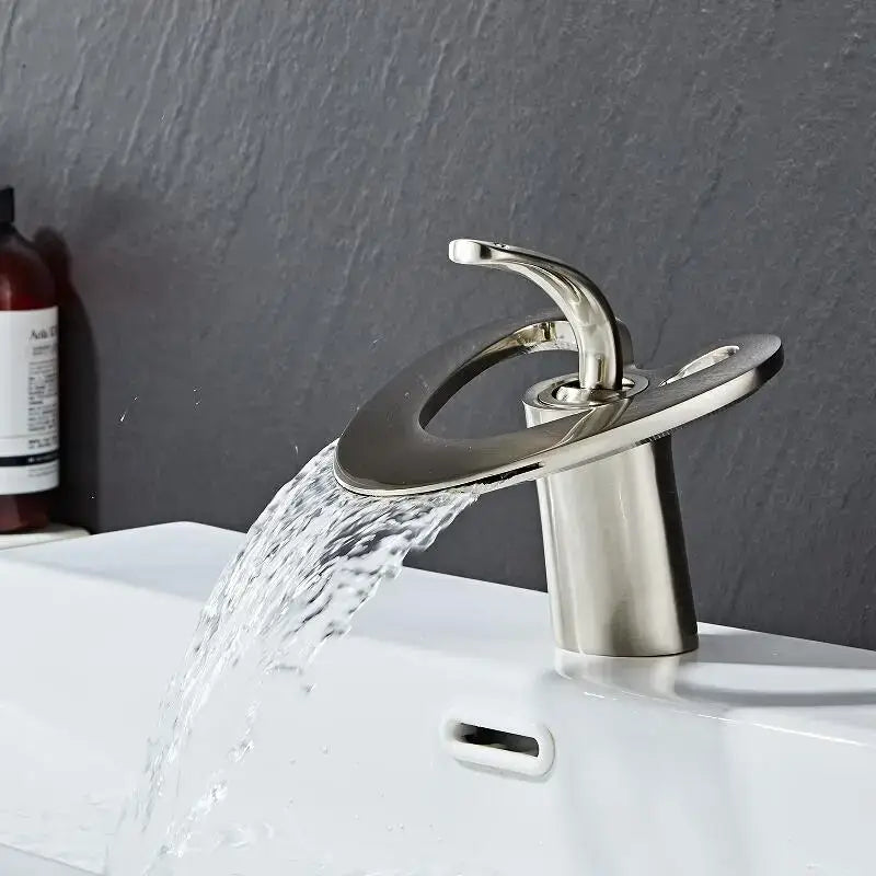Modern brushed nickel basin faucet with sleek curved spout and circular base for decorbites golden white bathroom sink