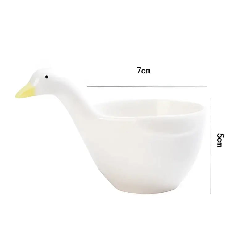 White goose ceramic snack bowl shaped like a duck with yellow beak black eye and handle for kitchen sauce use