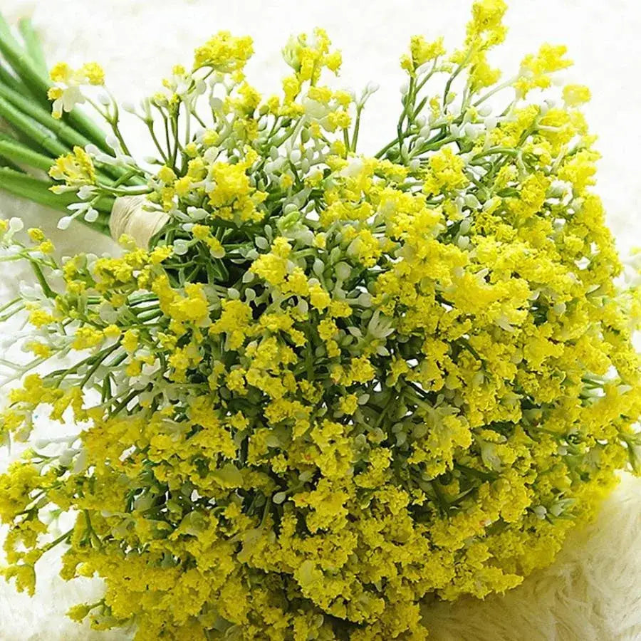 A vibrant bouquet of artificial yellow and white gypsophila flowers with green stems for wedding and home decor