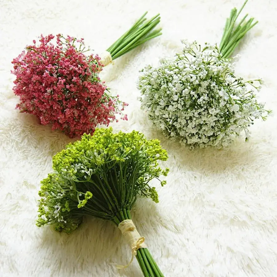 Three artificial gypsophila bouquets in pink white and green tied with natural twine for wedding and home decor