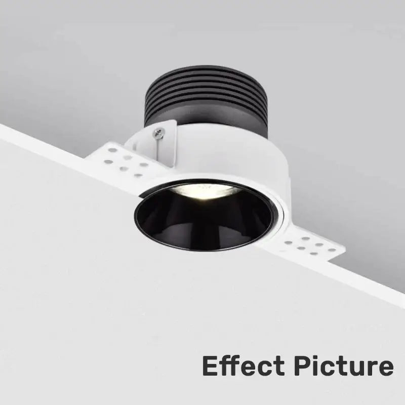 White honeycomb double head square led downlight with a white and black recessed fixture and ribbed black top ring
