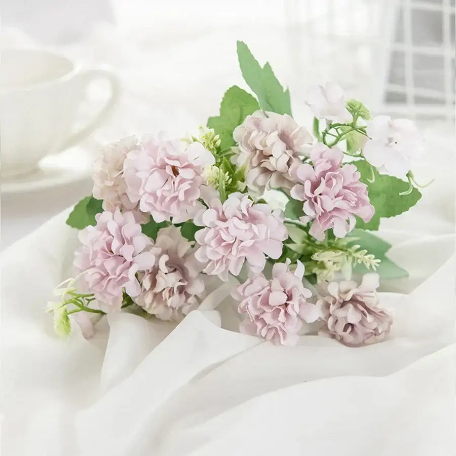 White hydrangea bouquet with artificial pink and white flowers in ribbed glass vase for living room decor by decorbites hydrangea bouquet