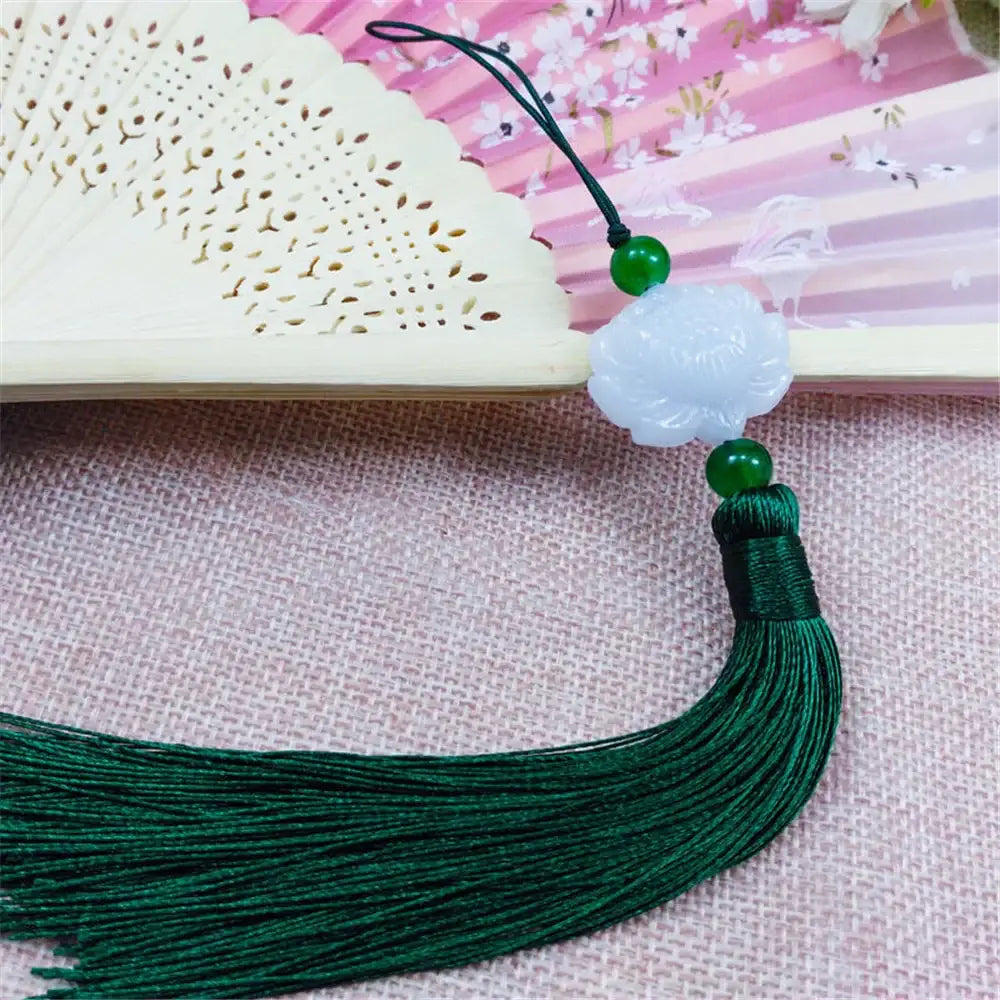White jade lotus pendant with emerald green beads and dark green silk tassel for living room decor