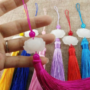 White jade lotus pendant with vibrant pink tassel and bead on colorful silk cord for living room decor