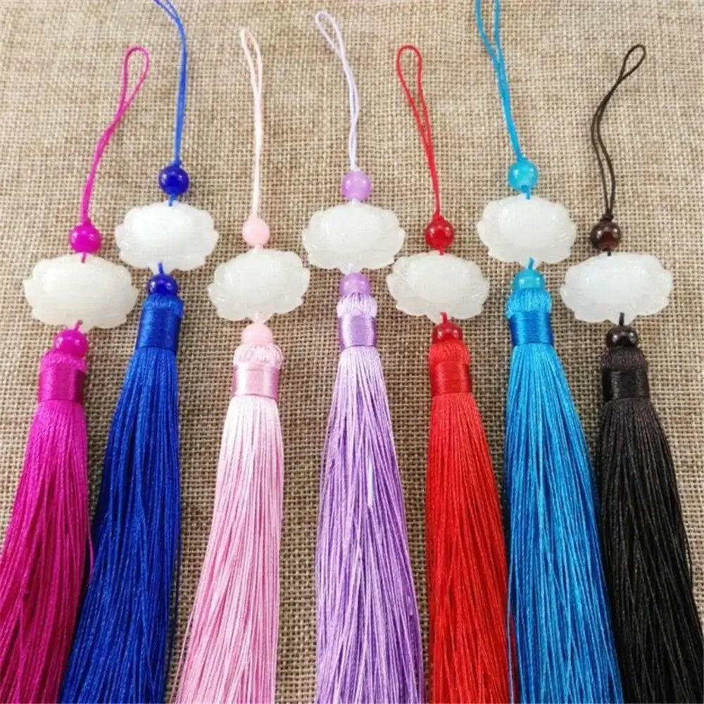 A set of seven colorful silk tassel decorative pendants with white jade lotus cloud-shaped charms for living room decor