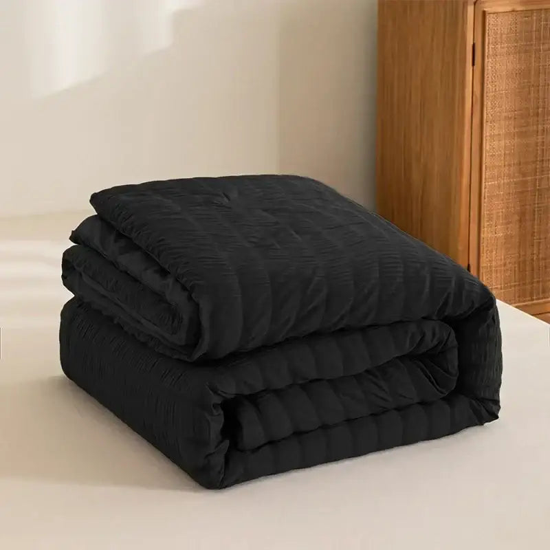 Black quilted comforter with soft textured surface and subtle vertical stitching for decorbites king size seersucker quilt