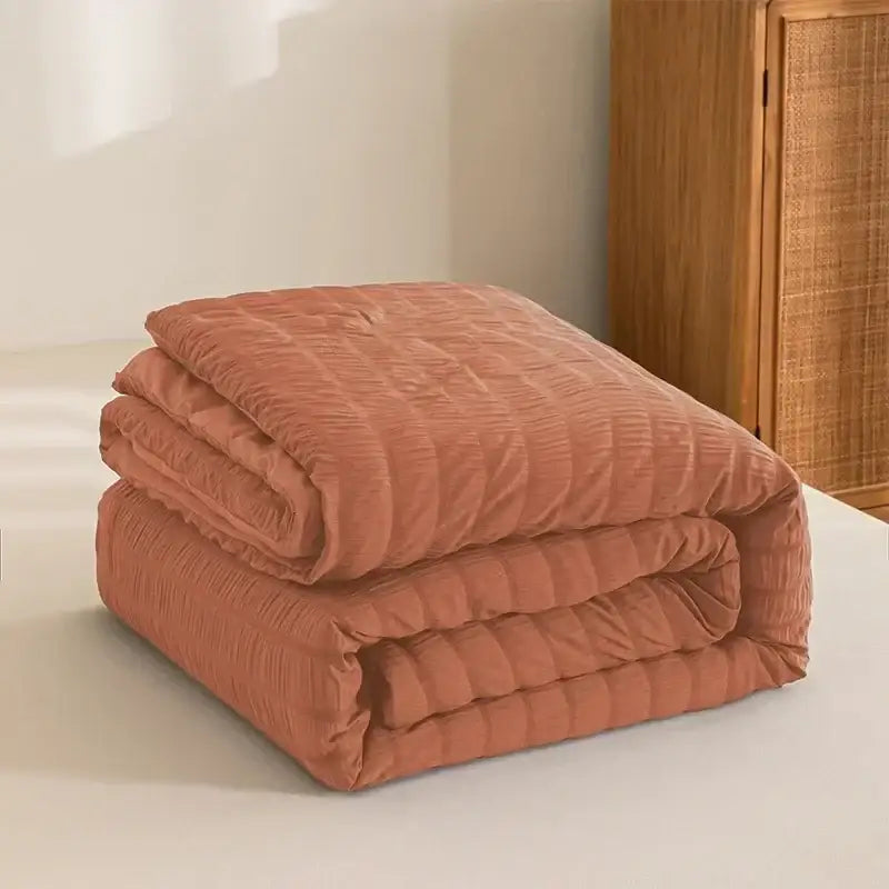 A rust-colored soft seersucker quilt with ribbed texture for decorbites king size all season comforter use