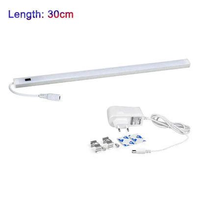White led motion sensor cabinet light strip with slim design includes power adapter and mounting hardware for under counter use