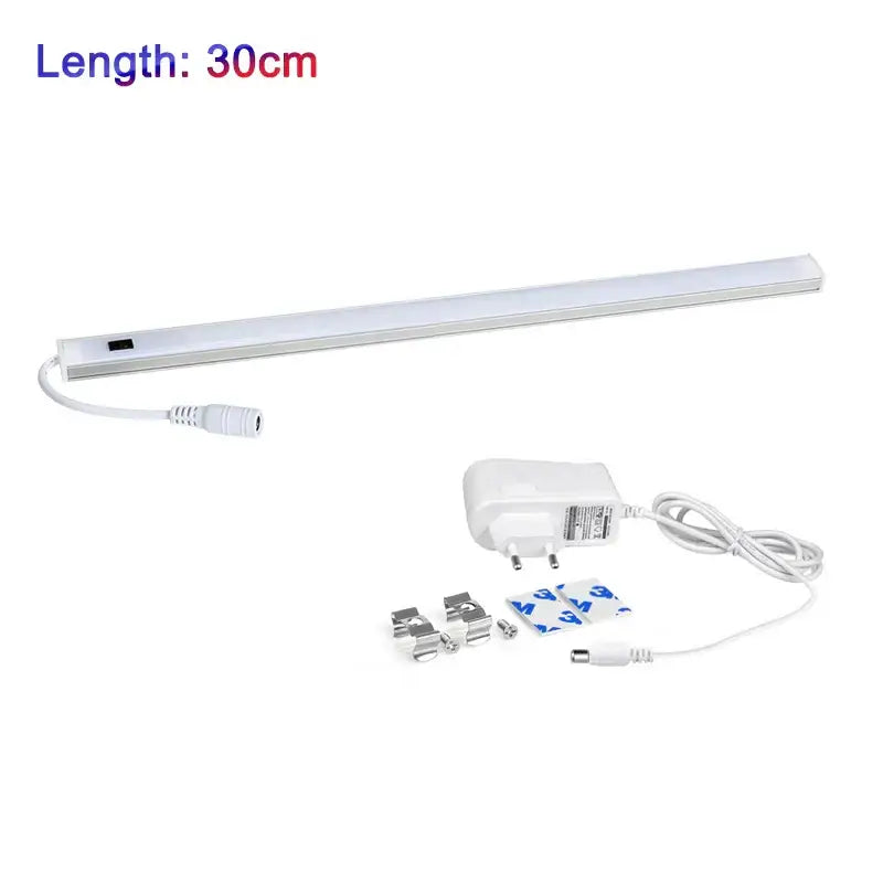 White led motion sensor cabinet light strip with slim design includes power adapter and mounting hardware for under counter use
