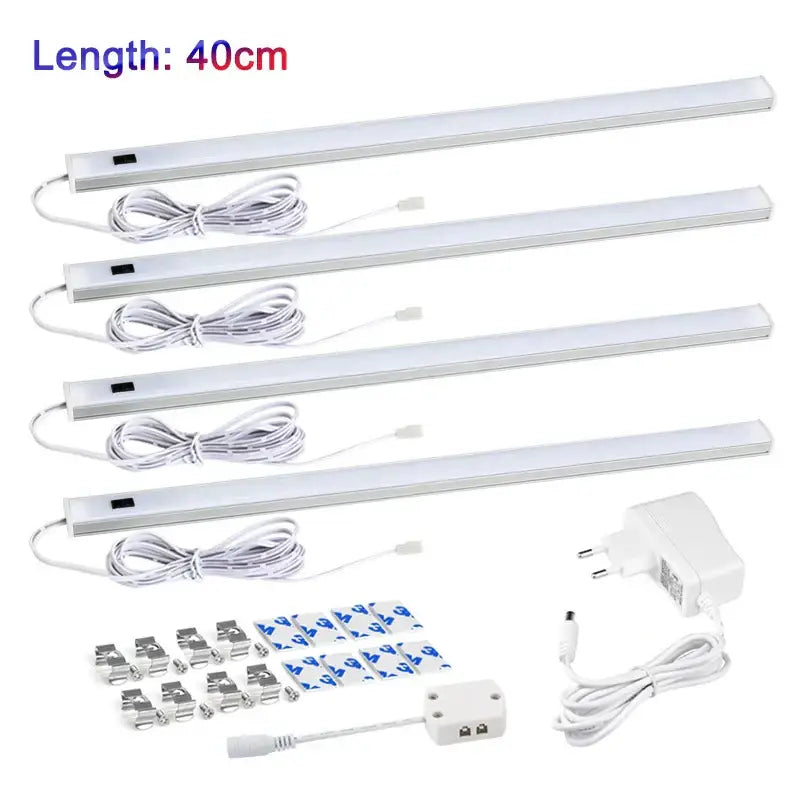 Four white led motion sensor cabinet lights 40cm each with sleek design and included mounting hardware for under counter use
