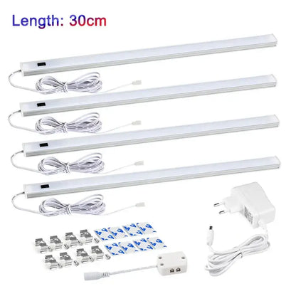 Four white led motion sensor cabinet lights 30cm with sleek aluminum casing and integrated power cords for under counter use