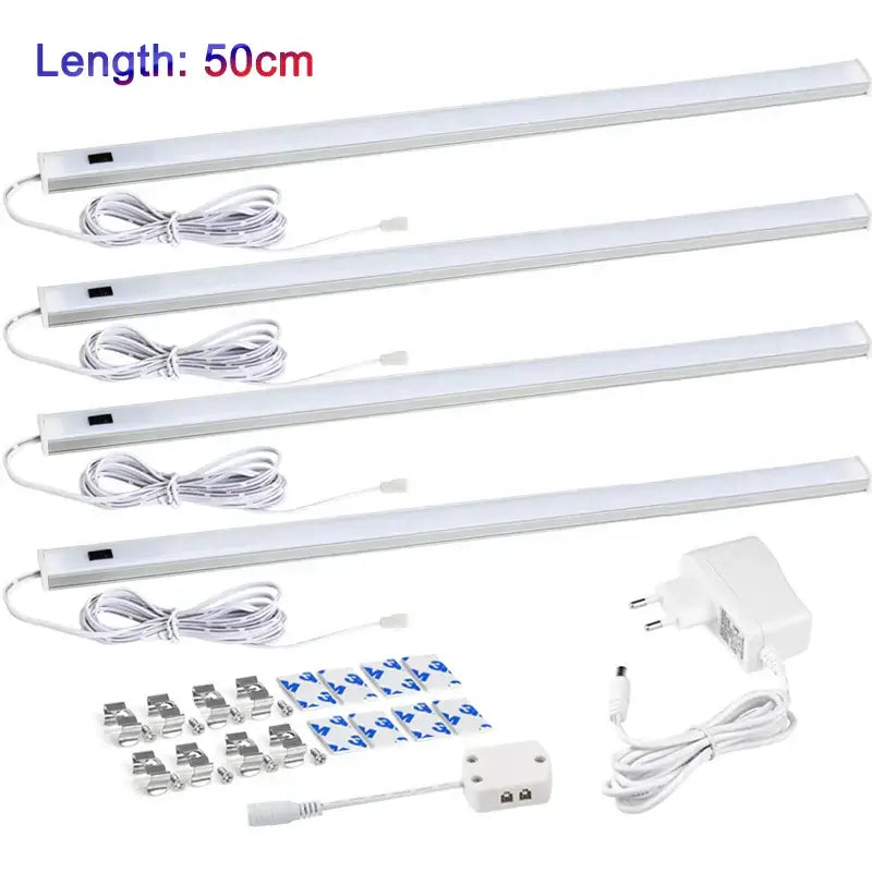 Four white 50cm led strip lights with integrated power cords and mounting accessories for motion sensor cabinet light use