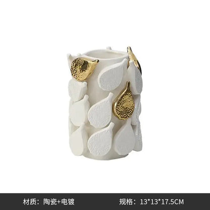 White ceramic vase with textured white and gold-toned leaves featuring lemon carambola design for living room decor